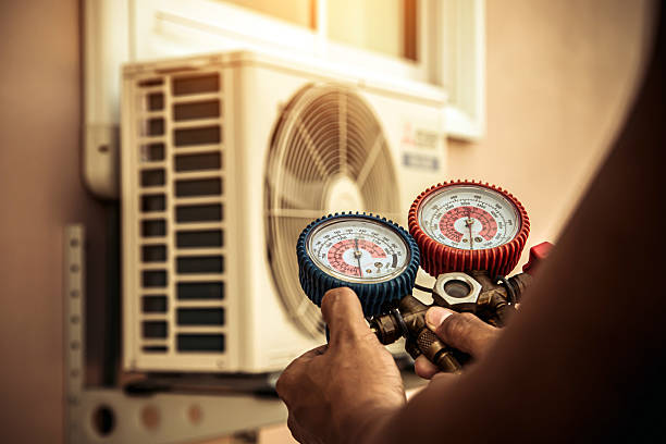 Professional Air Conditioning Service technician working in Selma, AL